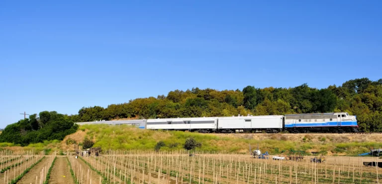 Movie railroad train in farm field